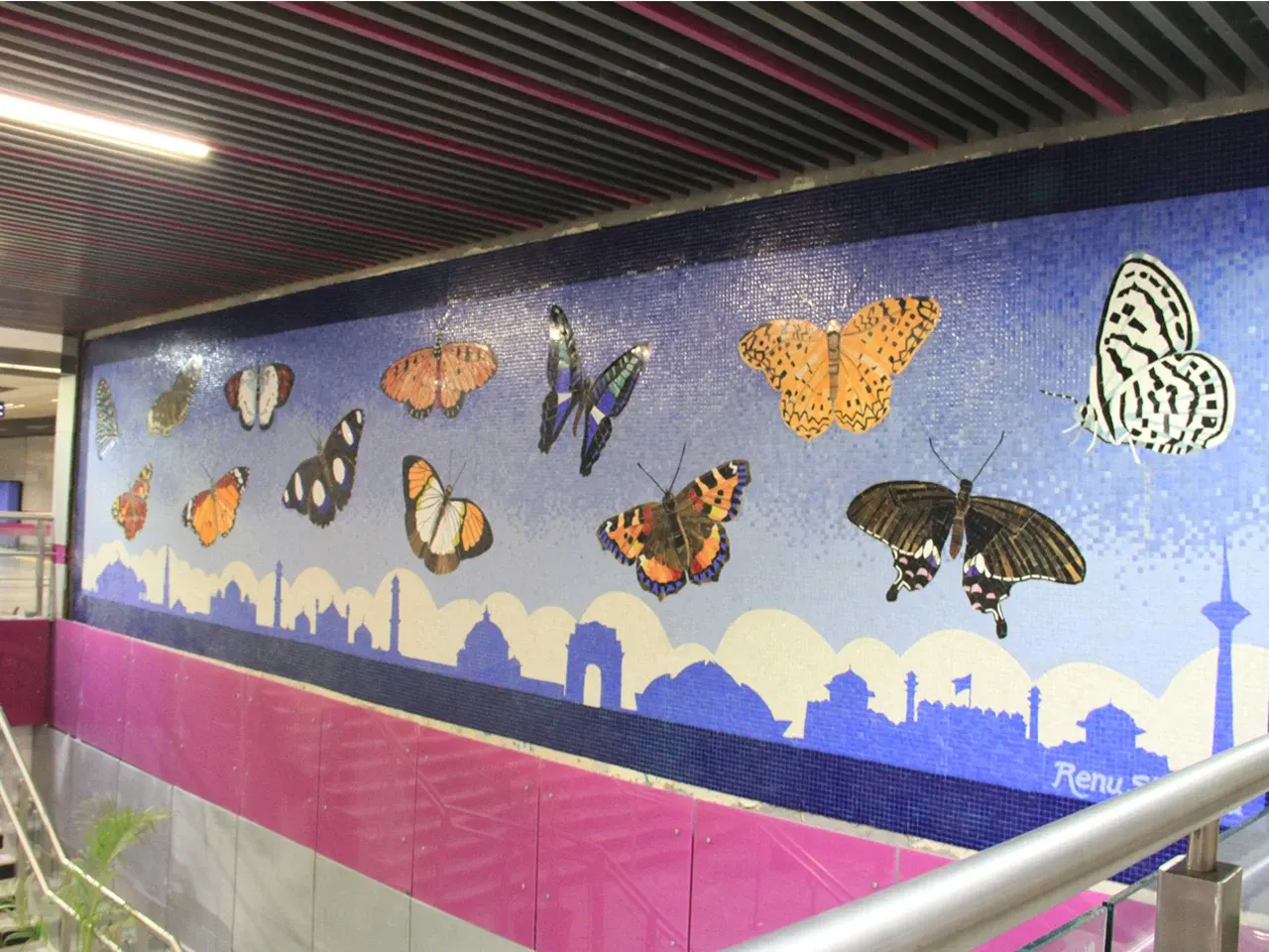 Chirag Delhi metro station mosaic mural of butterflies over the Delhi skyline by Renu Sharma